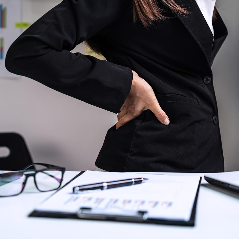 Stressed Woman Suffering from Back Pain