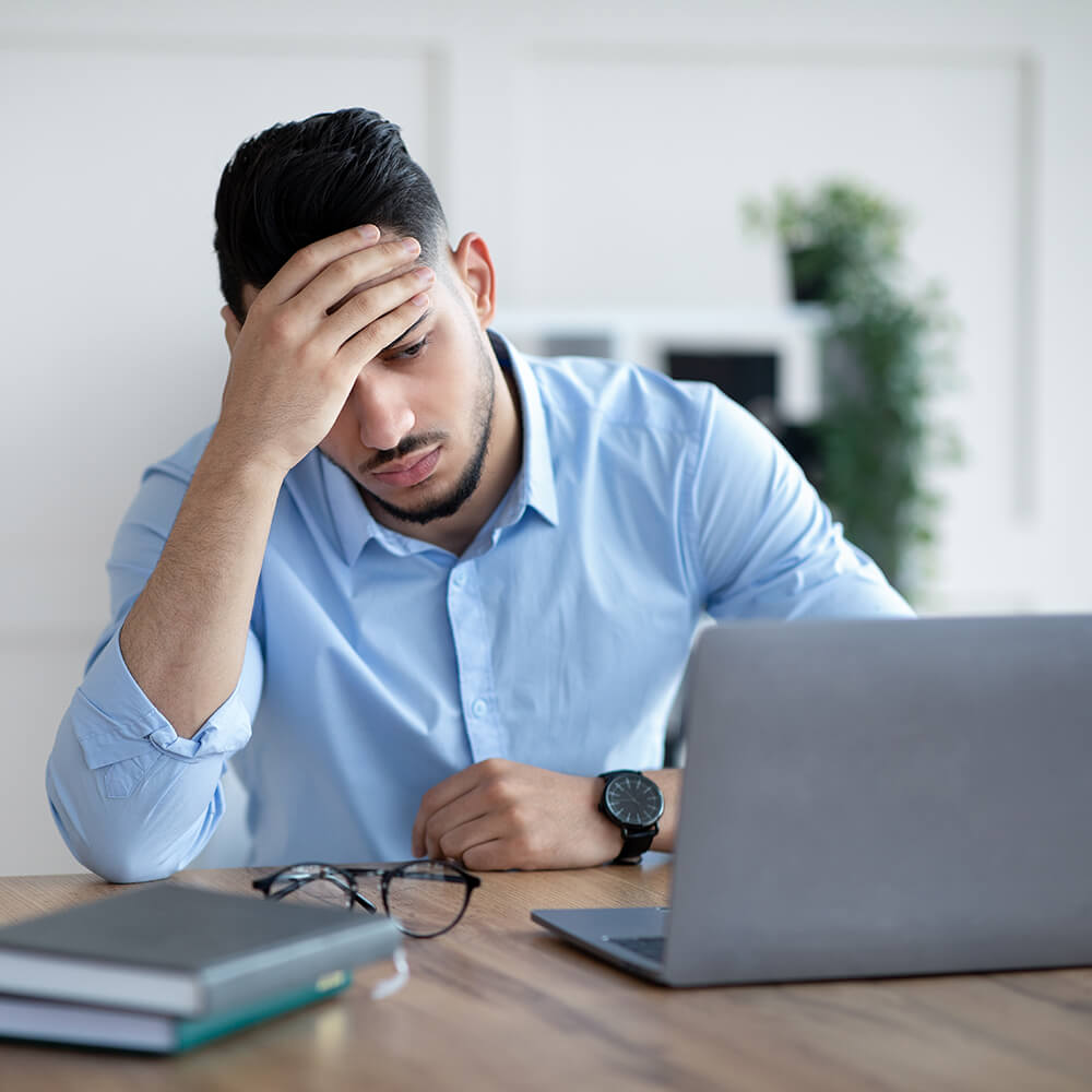 Young Male Experiencing a Headache